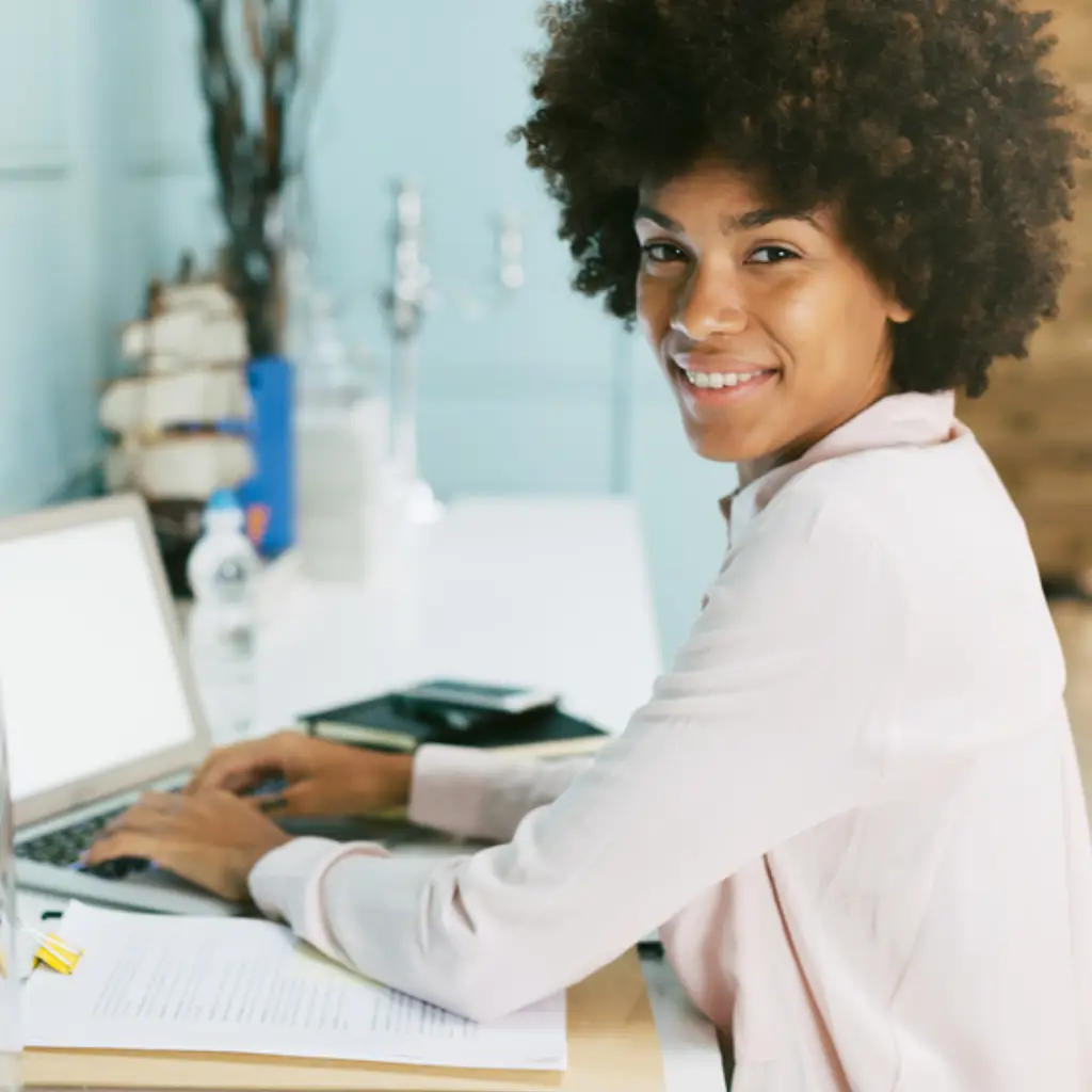 Happy remote professionals collaborating across time zones with digital dashboards.